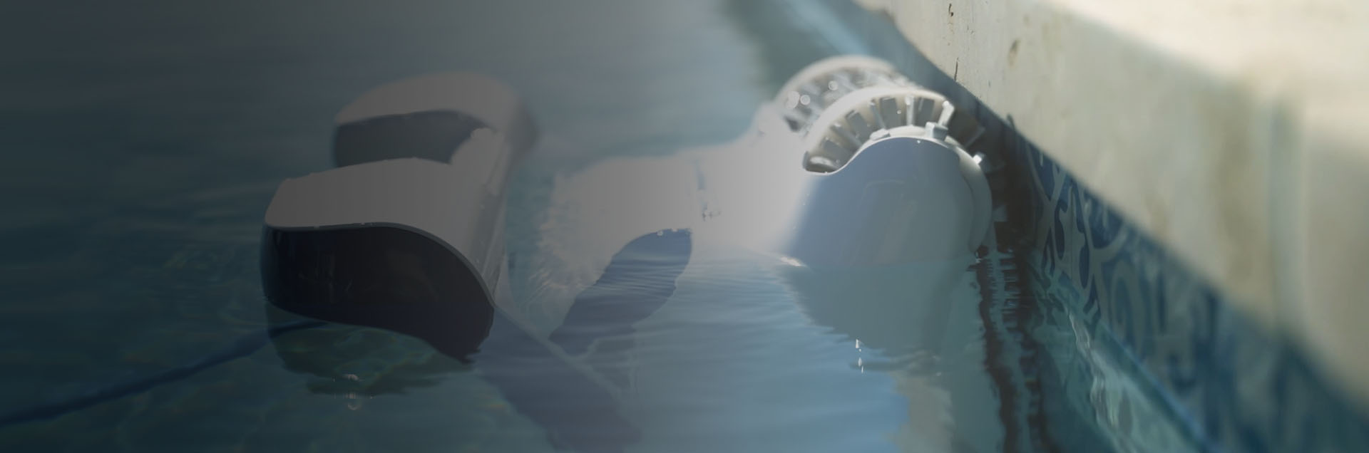Dolphin Sigma Robotic Pool Cleaner cleaning the waterline
