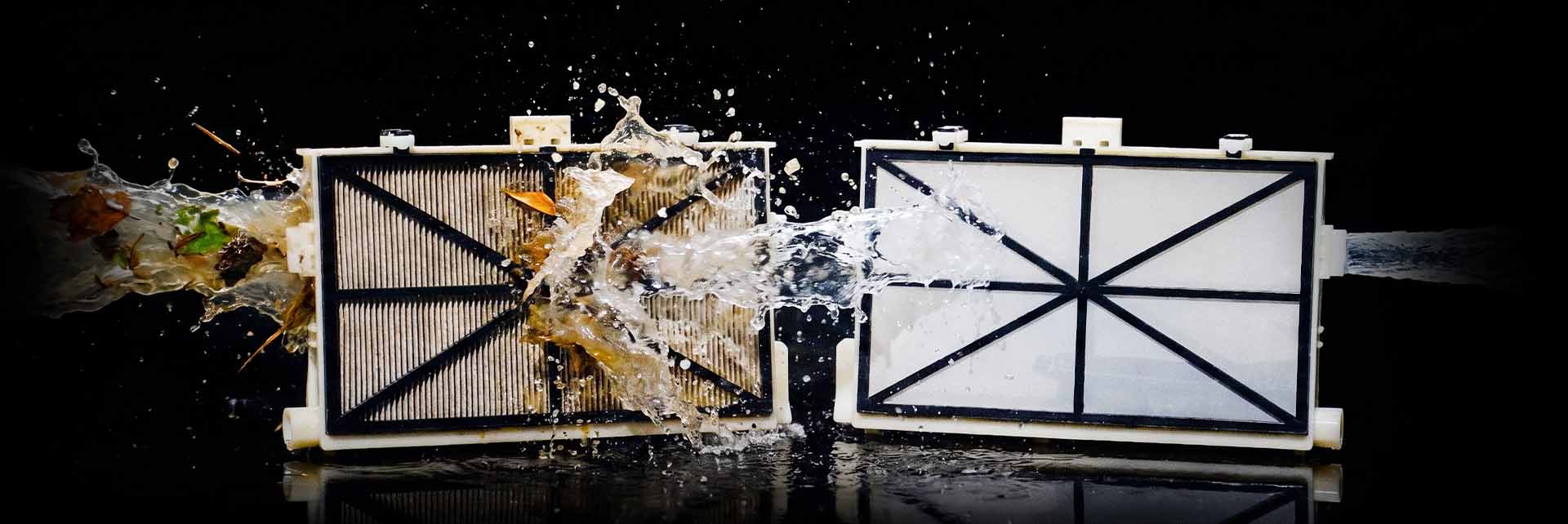 A Dolphin Sigma NanoFilter cartridge loaded with debris next to a clean one